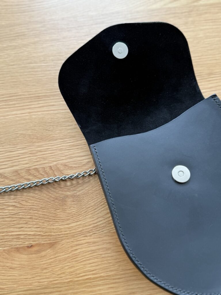 Black leather sporran lined with suede, handcrafted and hand-stitched by Kate Robertson